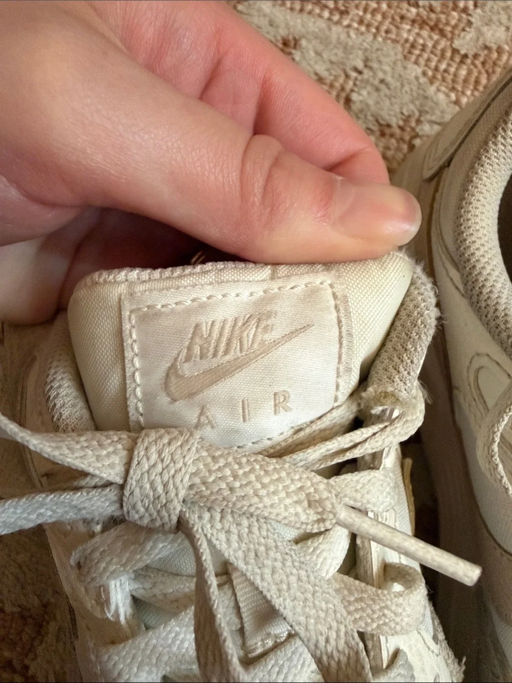 Nike off-white and beige low-top sneakers